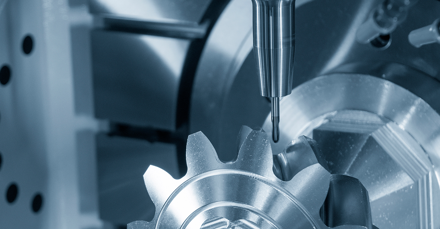 Close-up scene of 5-axis CNC milling of a metal gear.