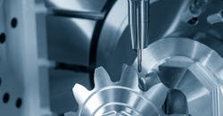 Close-up scene of 5-axis CNC milling of a metal gear. Close-up scene of 5-axis CNC milling of a metal gear.