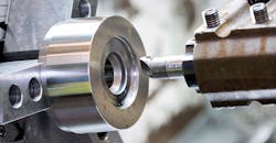 CNC grinding process, close up. CNC grinding process, close up.