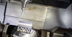 Five-axis CNC machine. Five-axis CNC machine.