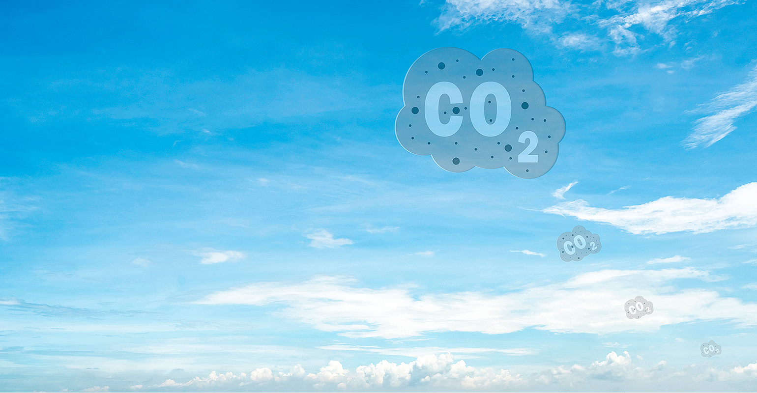 CO2 symbol on blue sky and white clouds.