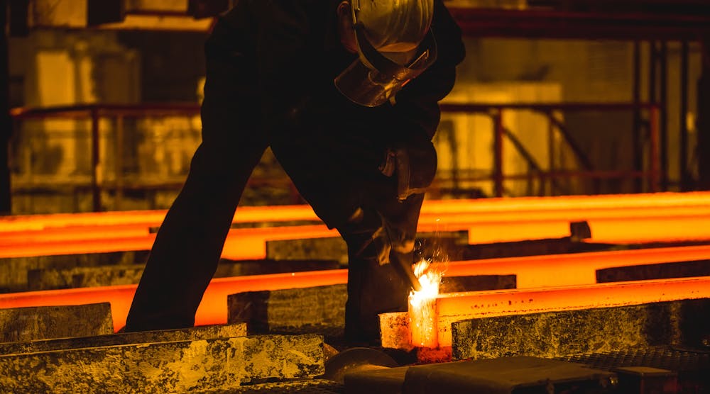 Steel billets, torch cutting at the run-out stage of continuous casting.