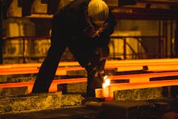 Steel billets, torch cutting at the run-out stage of continuous casting. Steel billets, torch cutting at the run-out stage of continuous casting.