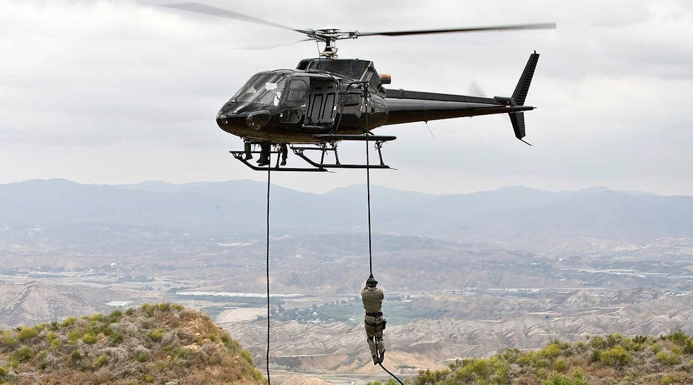 Eurocopter AS350 Ecureuil A-Star helicopter flying over Malibu, Calif., during a &lsquo;fast rope&rsquo;-type military operation.