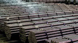 Steel bars stored in a warehouse.