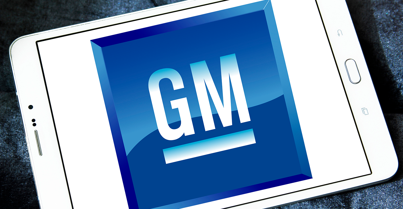 GM logo displayed on a tablet illustration.