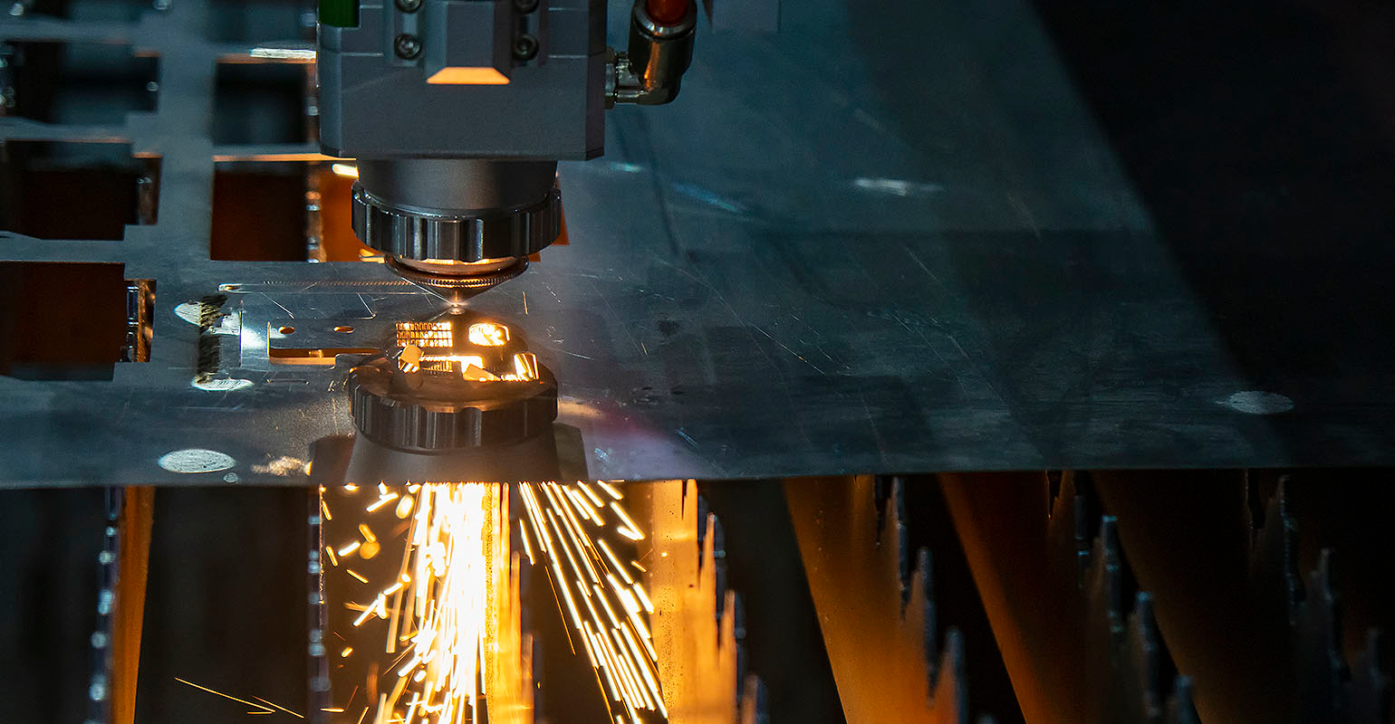 A fiber laser cutting machine controlled by a CNC program system.