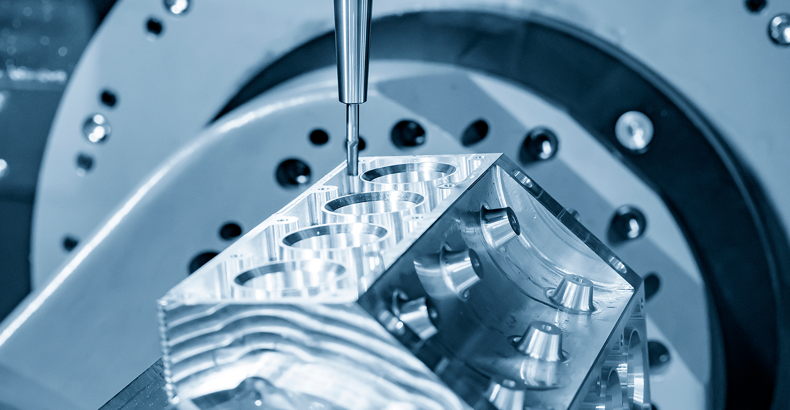 Endmills in use for five-axis CNC milling on an aluminum V8 engine.