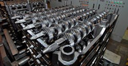 Machined automotive transmission gears. Machined automotive transmission gears.