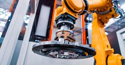 Robotic arm in an automated production cell. Robotic arm in an automated production cell.