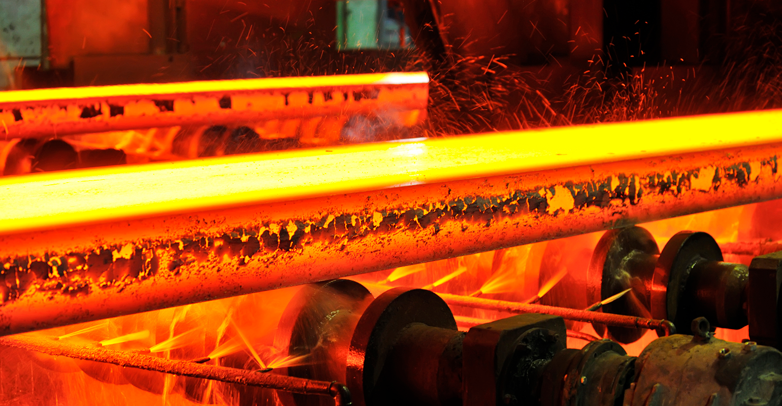 Hot steel slabs on continuous caster runout.