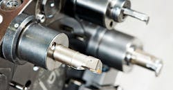 Cutting tools on an automated lathe. Cutting tools on an automated lathe.