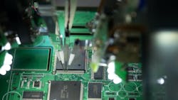 CNC machine solders the microchip to the motherboard. CNC machine solders the microchip to the motherboard.