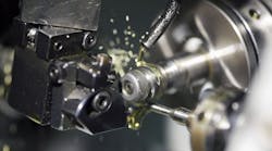 Lubricant in close-up of a turning operation. Lubricant in close-up of a turning operation.