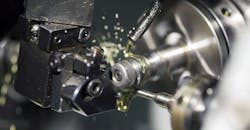 Lubricant in close-up of a turning operation. Lubricant in close-up of a turning operation.