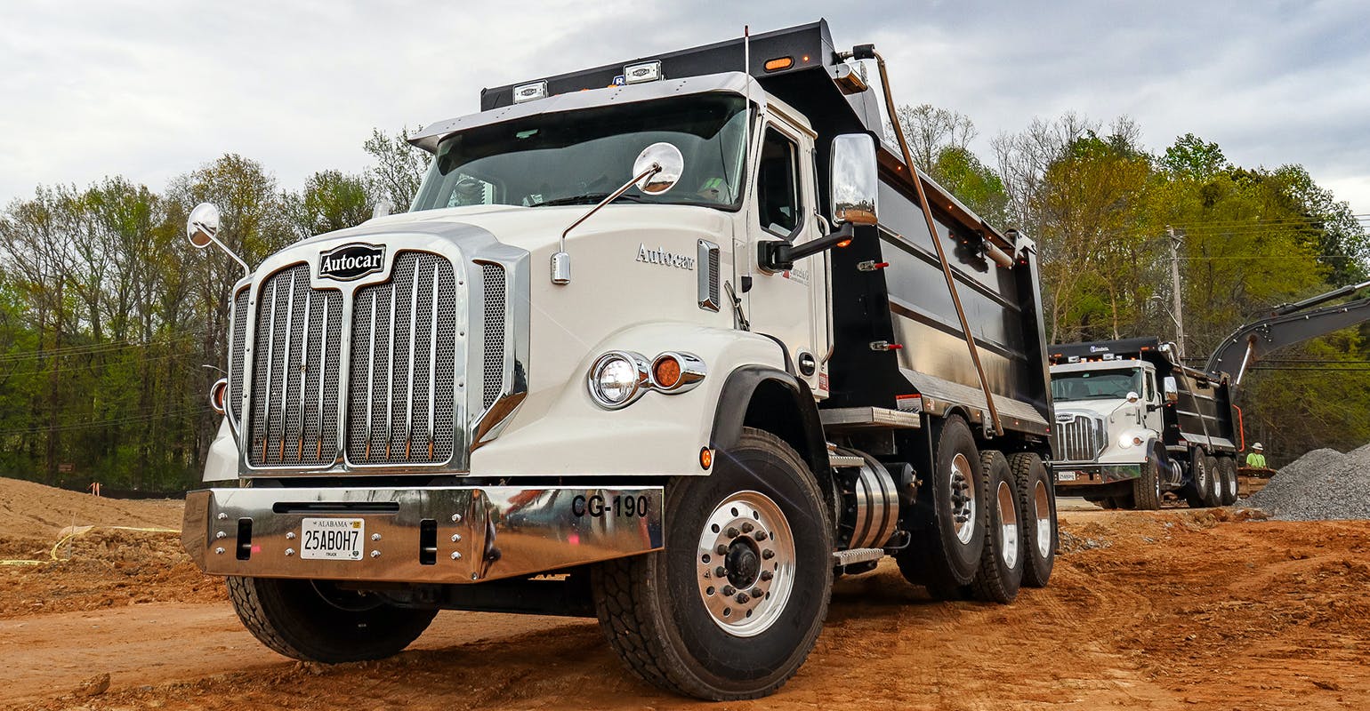 An Autocar Industries vocational truck used in road construction.