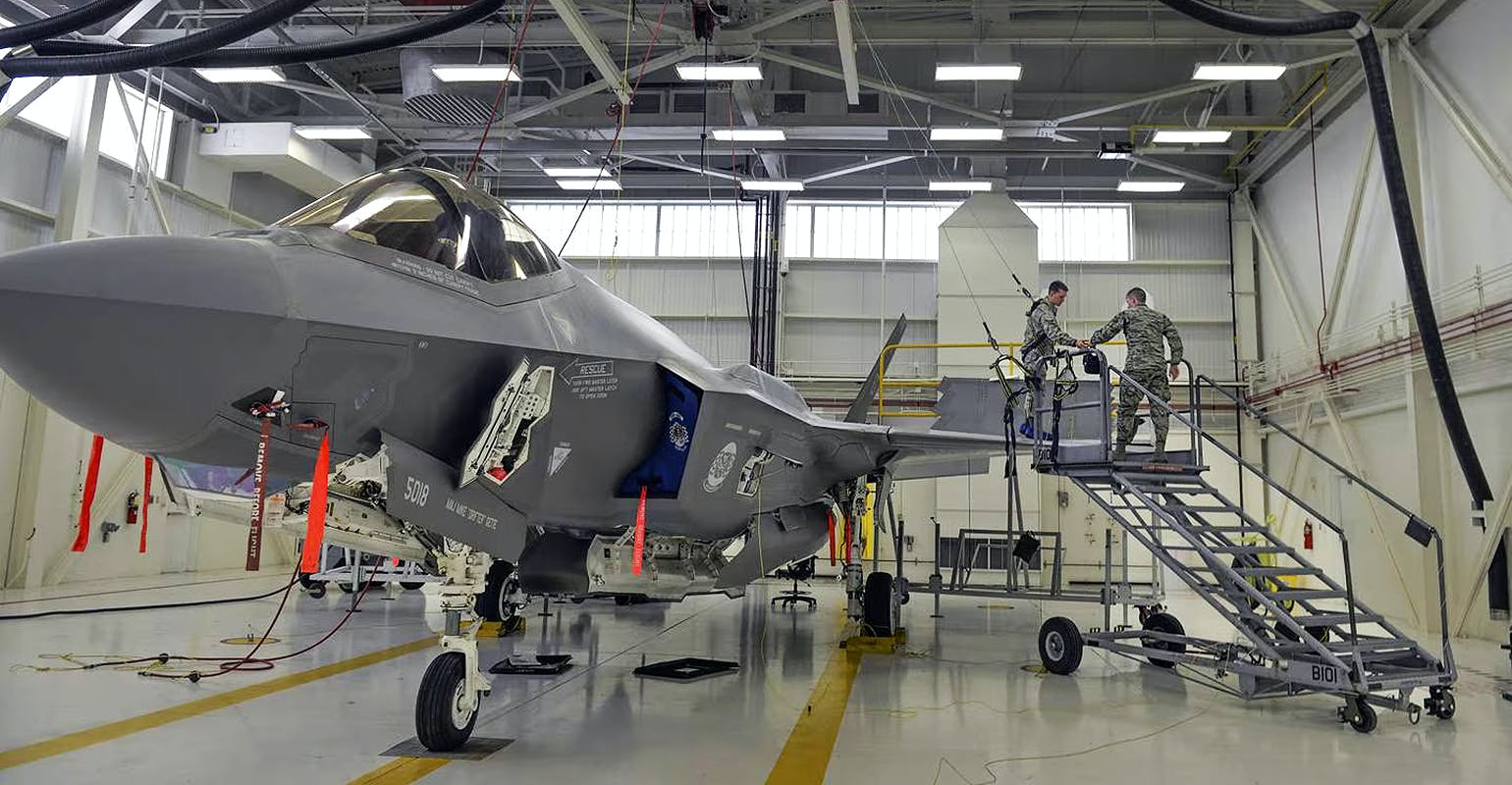 Airmen prepare an F-35A jet for maintenance at Eglin Air Force Base, Fla.