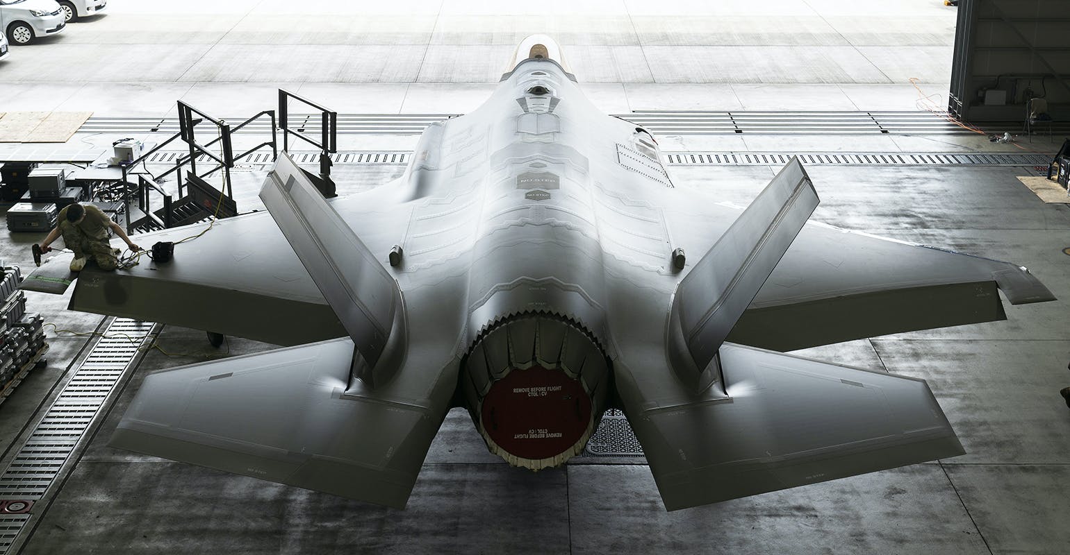 A U.S. Air Force F-35A Lightning II fighter jet assigned to the 356th Expeditionary Fighter Squadron undergoes routine maintenance in an aircraft hangar.