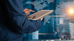 Executive using table to manage manufacturing logistics. Executive using table to manage manufacturing logistics.