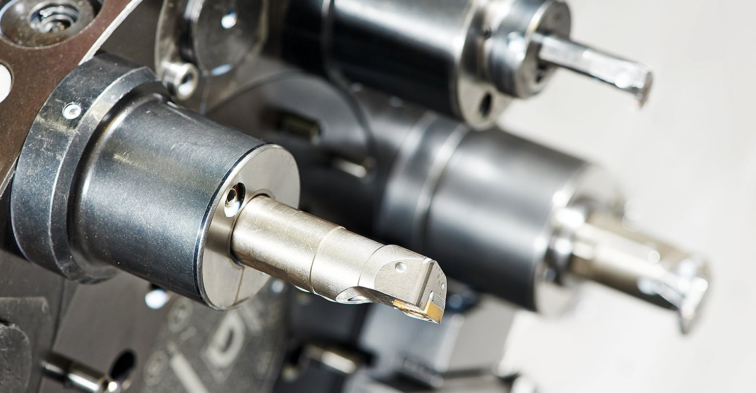 Cutting tools on an automated lathe.