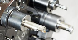 Cutting tools on an automated lathe. Cutting tools on an automated lathe.