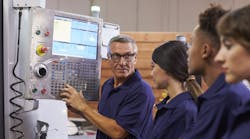 Training CNC machine shop workers. Training CNC machine shop workers.