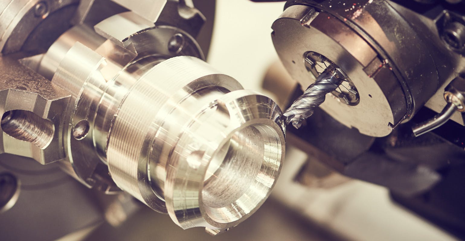 CNC machining, close-up of milling cutter with hard metal carbide insert.