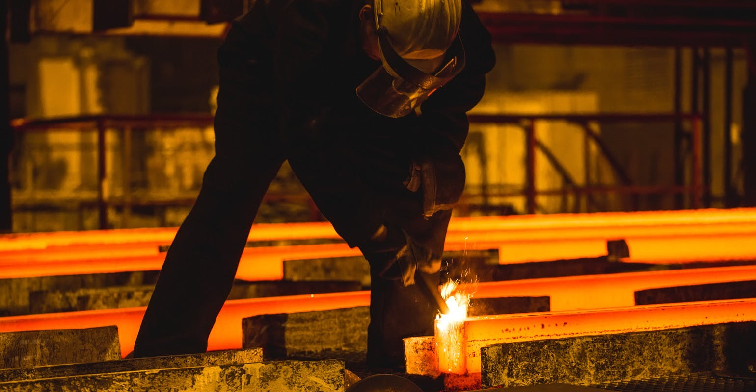 Oxy-torch cutting following continuous billet casting.