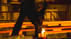 Oxy-torch cutting following continuous billet casting.