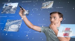 Young engineer/technologist working with virtual interface… Industrial enterprise management. Young engineer/technologist working with virtual interface… Industrial enterprise management.