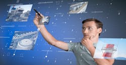 Young engineer/technologist working with virtual interface… Industrial enterprise management. Young engineer/technologist working with virtual interface… Industrial enterprise management.