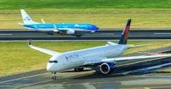 KLM Boeing 737 and Delta Airlines Airbus A350 jets. KLM Boeing 737 and Delta Airlines Airbus A350 jets.
