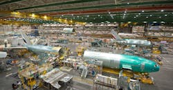 Boeing’s 1,000th 777 moves into the final body join position. This is where the three sections – front, mid and aft – come together. Shown here are the front and aft section of the airplane. When completed in this position the airplane will move to its next position final assembly. Boeing’s 1,000th 777 moves into the final body join position. This is where the three sections – front, mid and aft – come together. Shown here are the front and aft section of the airplane. When completed in this position the airplane will move to its next position final assembly.