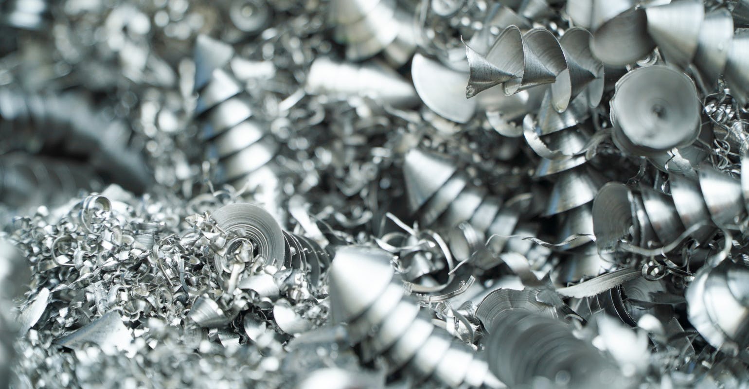 Aluminum chip waste after CNC turning.