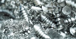 Aluminum chip waste after CNC turning. Aluminum chip waste after CNC turning.