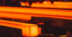 Continuous cast steel billets on a walking-beam runout table. Continuous cast steel billets on a walking-beam runout table.