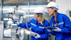 Technicians with controller and tablet check and perform maintenance with robotic arm. Technicians with controller and tablet check and perform maintenance with robotic arm.