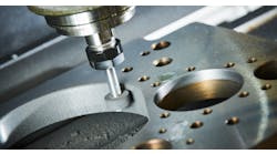 Grinding metal on a CNC machine. Grinding metal on a CNC machine.