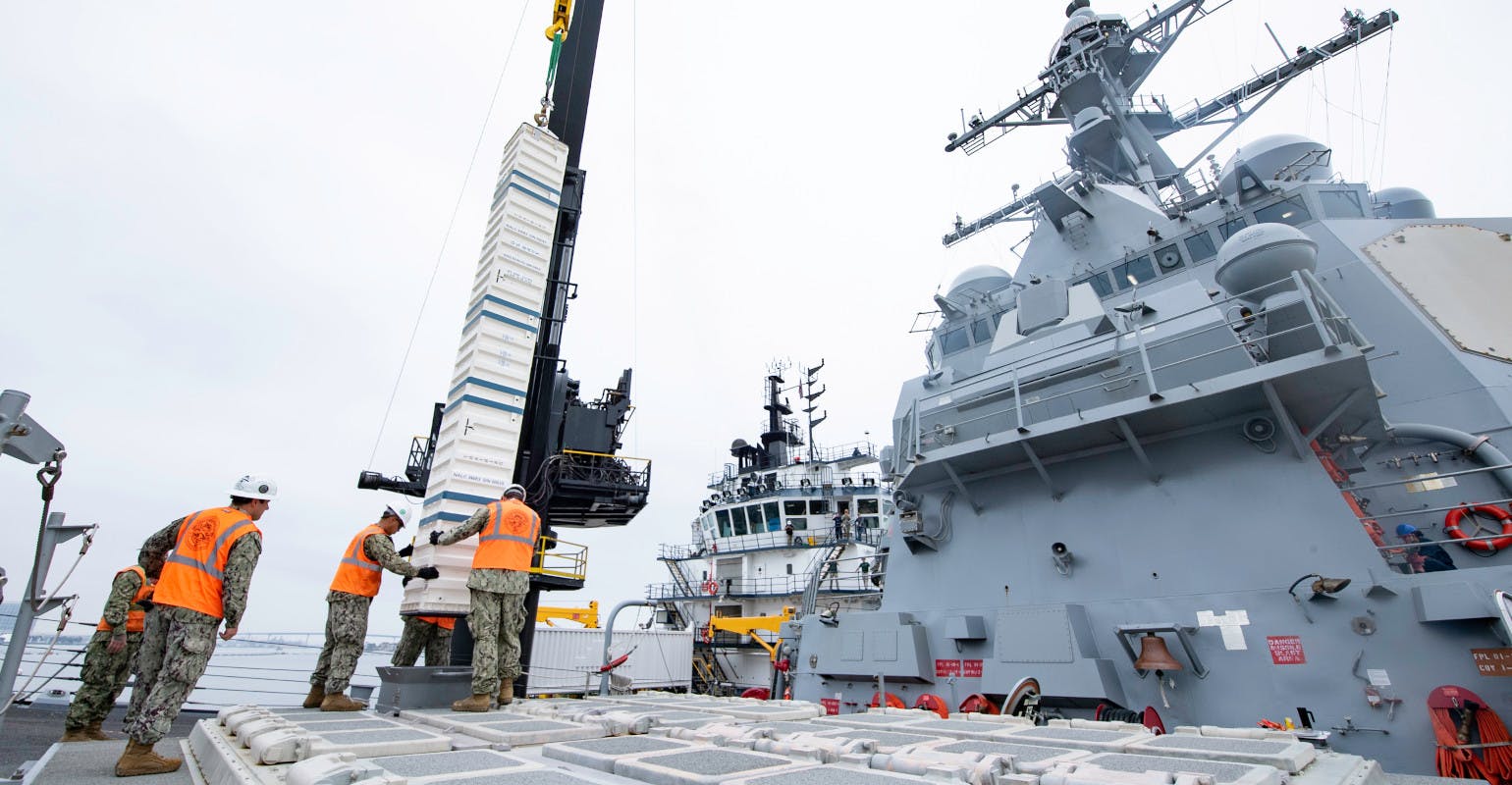 USN sailors aboard USS Spruance (DDG-111) guided-missile destroyer load ordnance into the ship&rsquo;s forward vertical launch system (VLS) cells during training, Oct. 4, 2022. US Navy