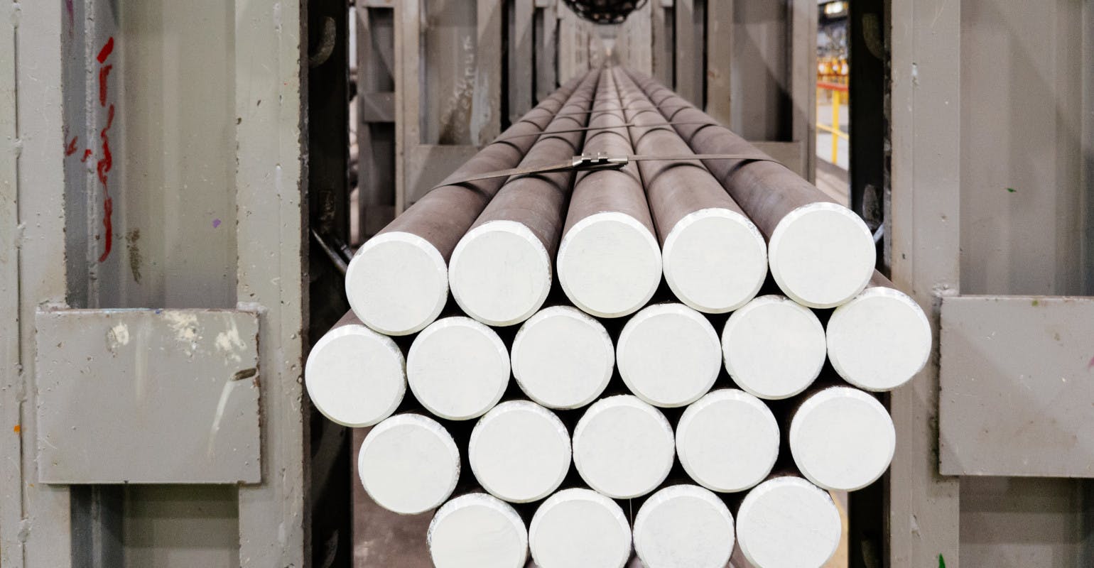 ID 325906258 Rolled steel bars in a storage rack.