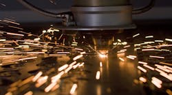 Laser cutting metal, up close. Laser cutting metal, up close.