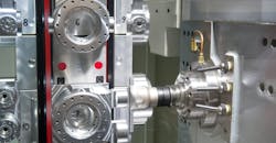 Photo of a CNC lathe for industrial milling. Photo of a CNC lathe for industrial milling.