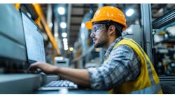 Industrial engineer overseeing production processes and monitoring advanced machinery. Industrial engineer overseeing production processes and monitoring advanced machinery.