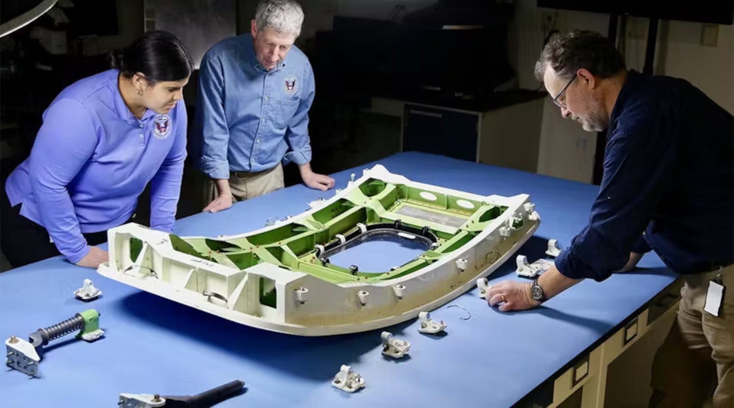 NTSB inspectors examine a 737 MAX 9 sidedoor plug.