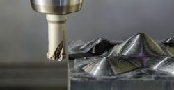 CNC milling machine rough-cutting an injection mold. CNC milling machine rough-cutting an injection mold.