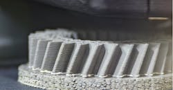 Close up view of metal 3D printing of a bevel gear. Close up view of metal 3D printing of a bevel gear.