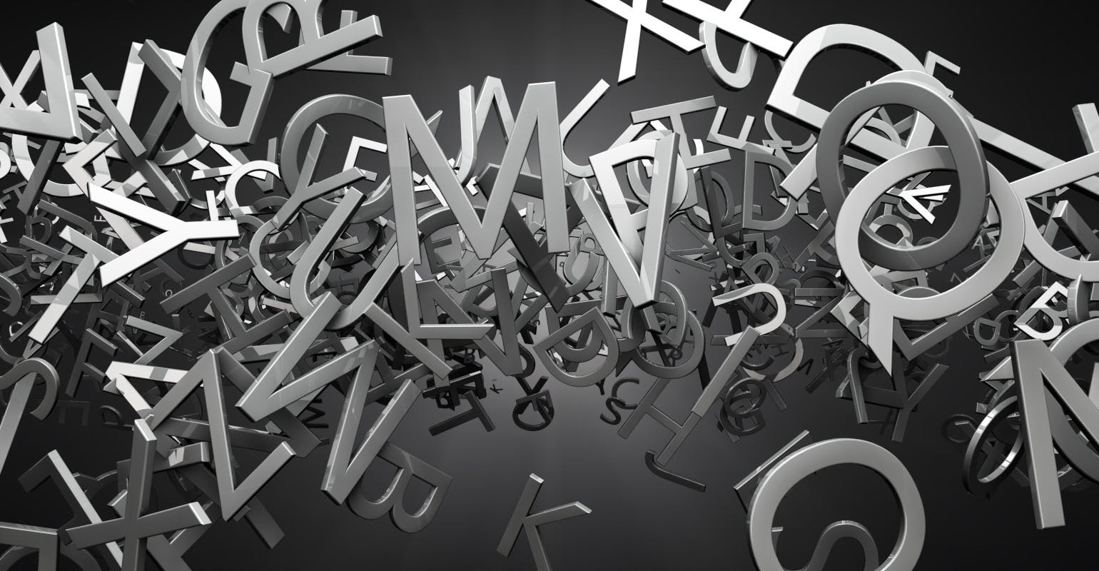 Metallic random letters floating on a dark background.