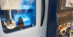 Five-axis machining center with CNC with display. Five-axis machining center with CNC with display.