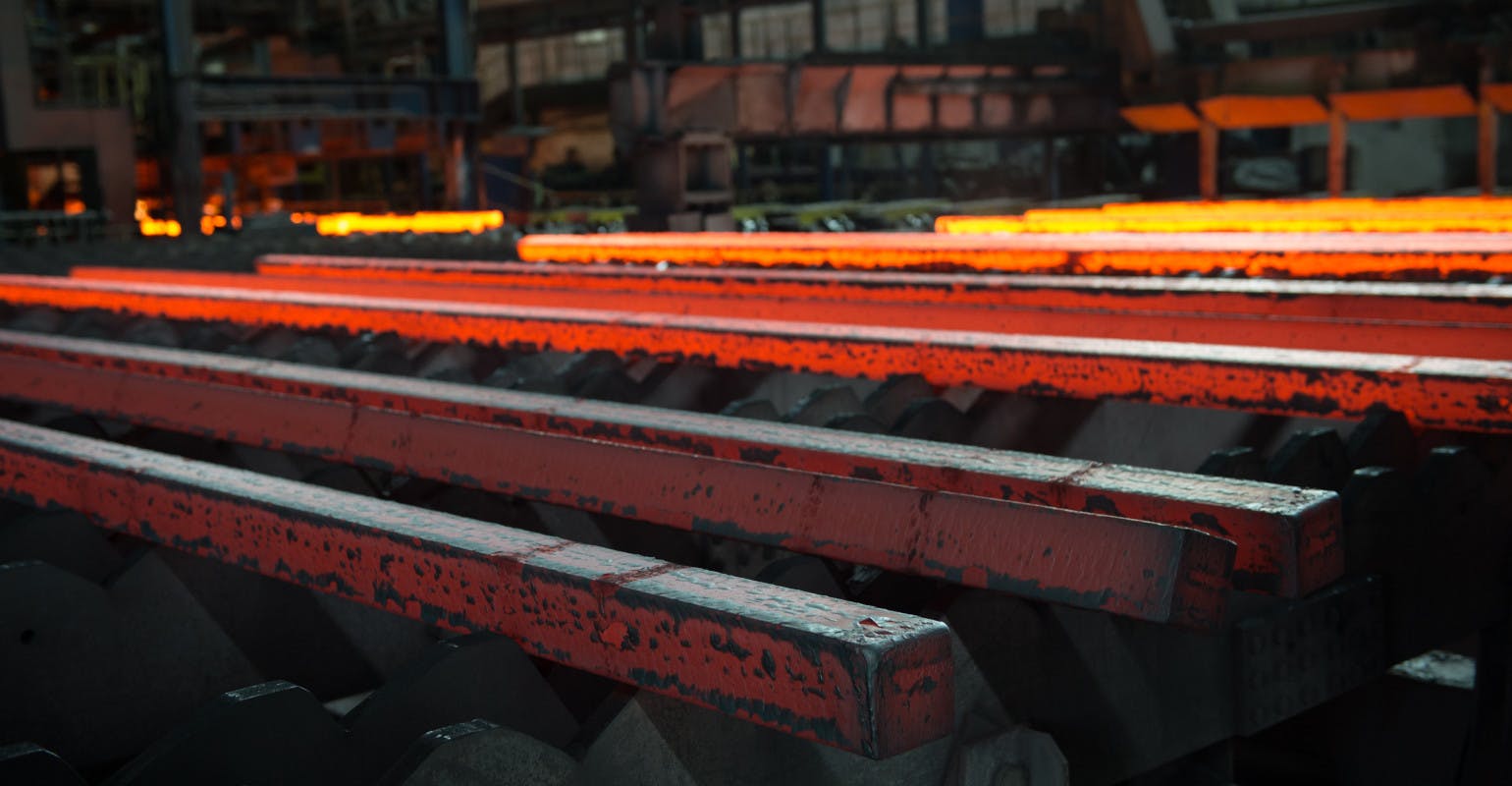 Steel bars on a cooling bed, after continuous casting.