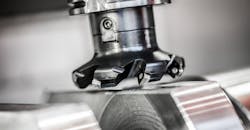 CNC milling machine in operation. CNC milling machine in operation.